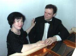 Antra and Normunds Viksne at a white grand piano